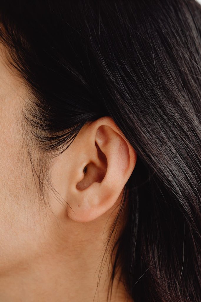 close up photo of a person s ear
