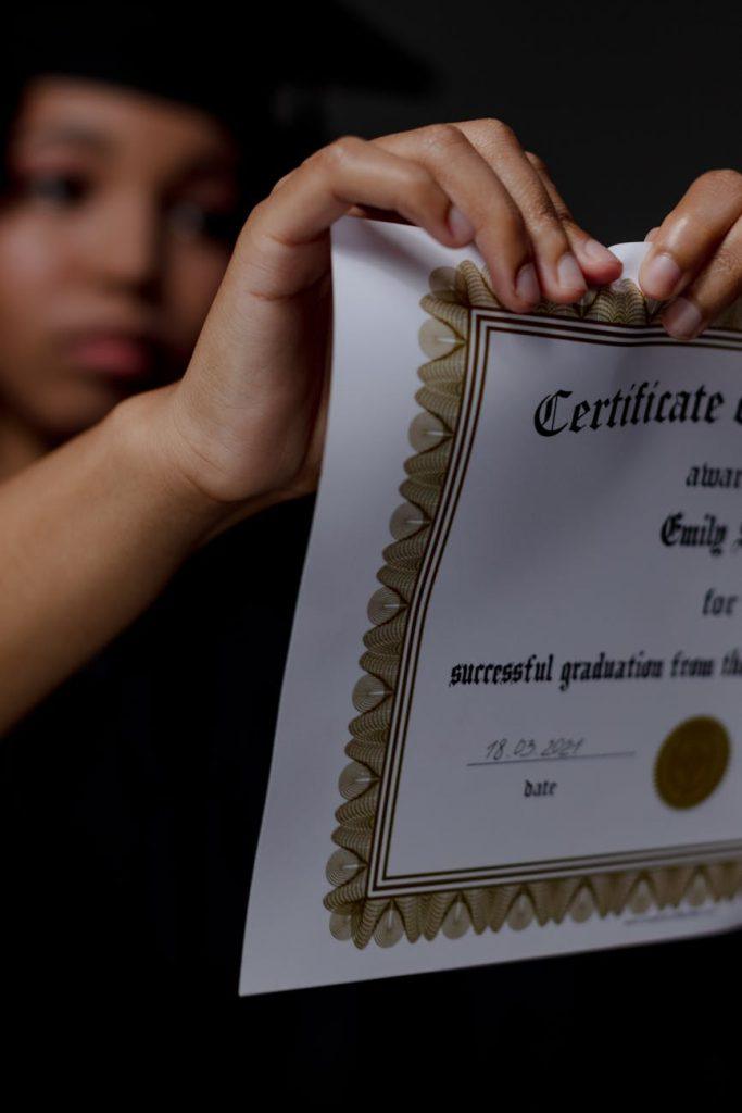 graduate student destroying diploma